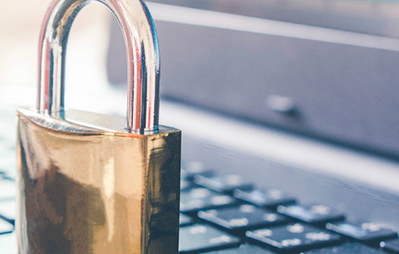 a brass lock on a laptop keyboard