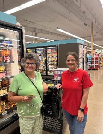 Employees grocery store shopping for the random acts of kindness day