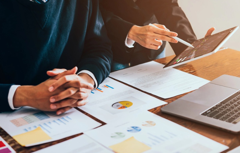 two people reviewing financial documents