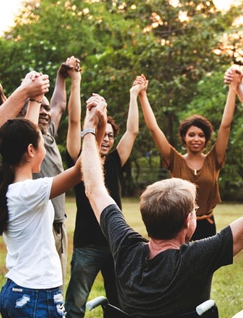 a group of people holding hands