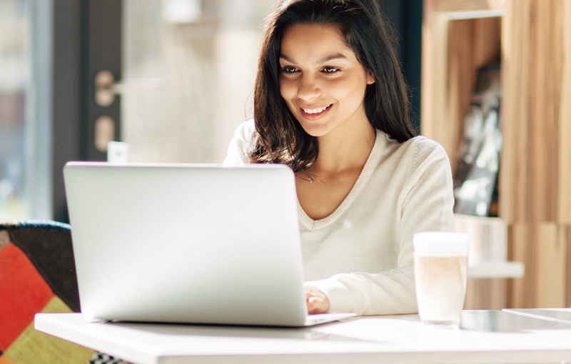 a woman working on her laptop computer