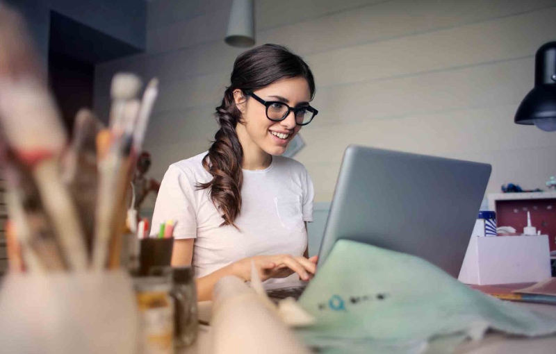 a woman working on her laptop computer