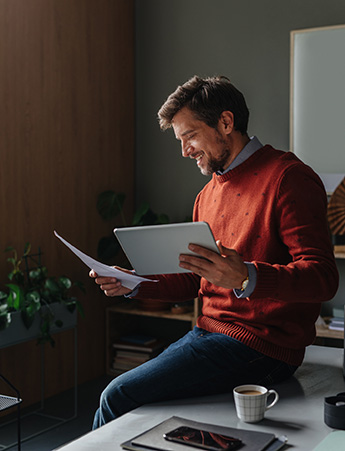 Man going over documents in home office